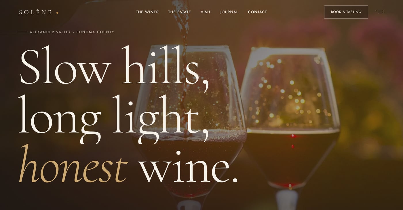 The Solène Estate homepage: two backlit wine glasses behind large serif type reading Slow hills, long light, honest wine