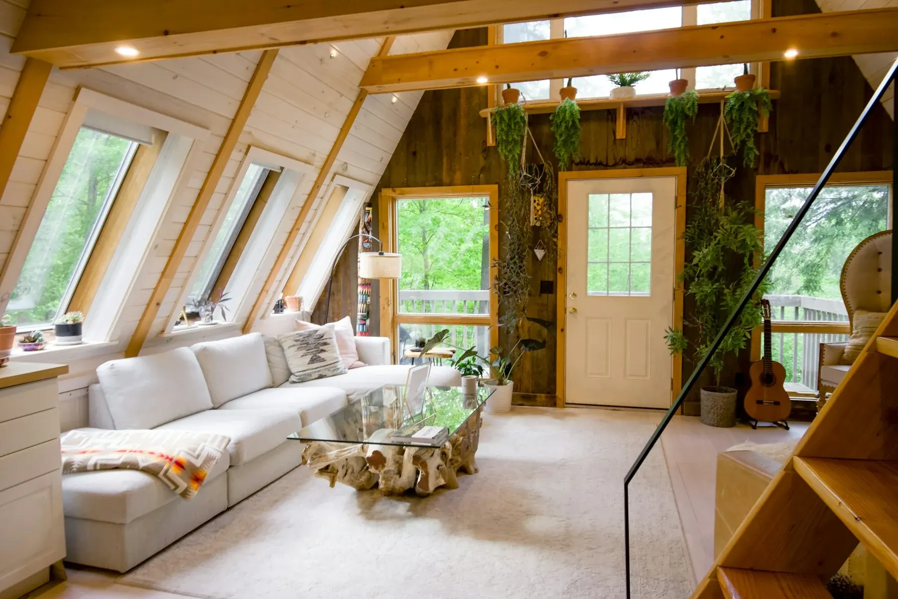 An airy lodge interior with natural timber and comfortable seating